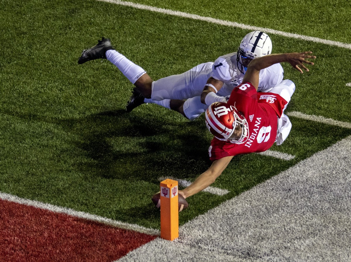 Indiana quarterback Michael Penix Jr. reaches for the pylon on an overtime 2-point conversion vs. Penn State in 2020. (Marc Lebryk/USA Today Sports)